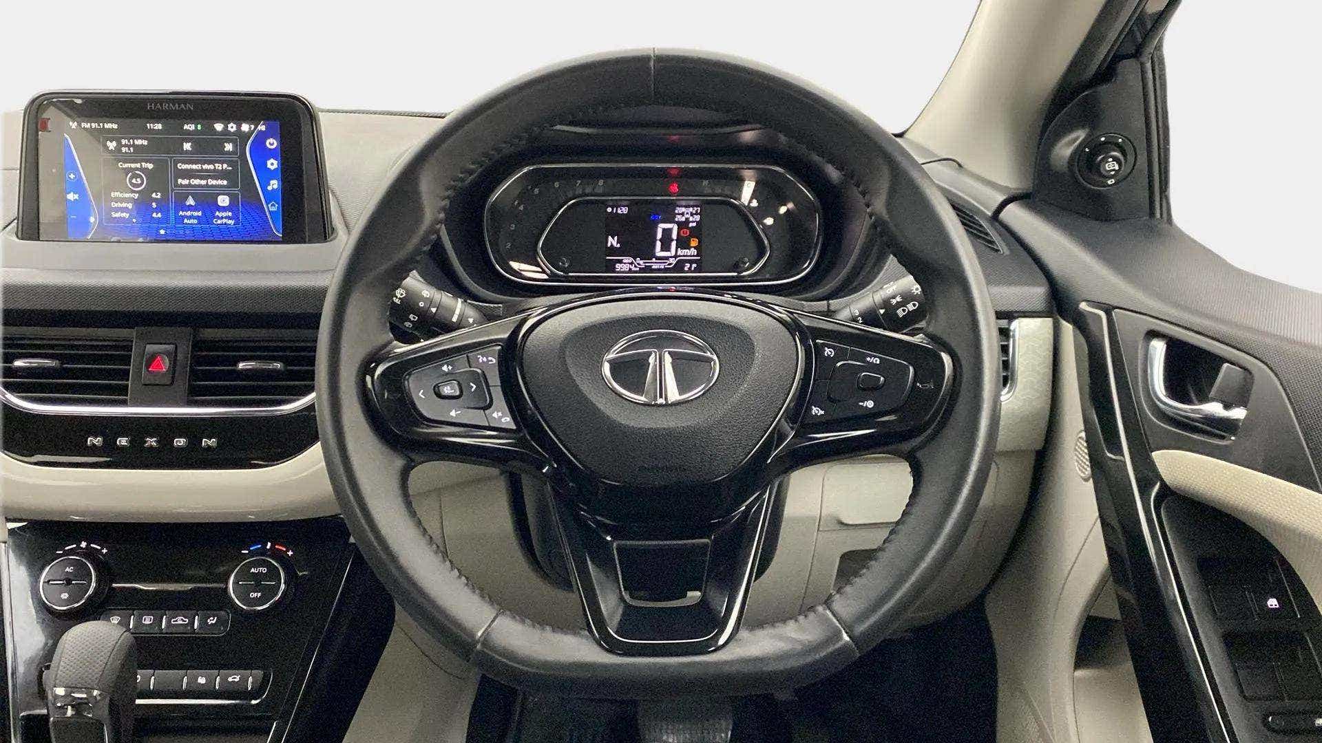 Interior dashboard and steering wheel of a Tata Nexon 2017-2023