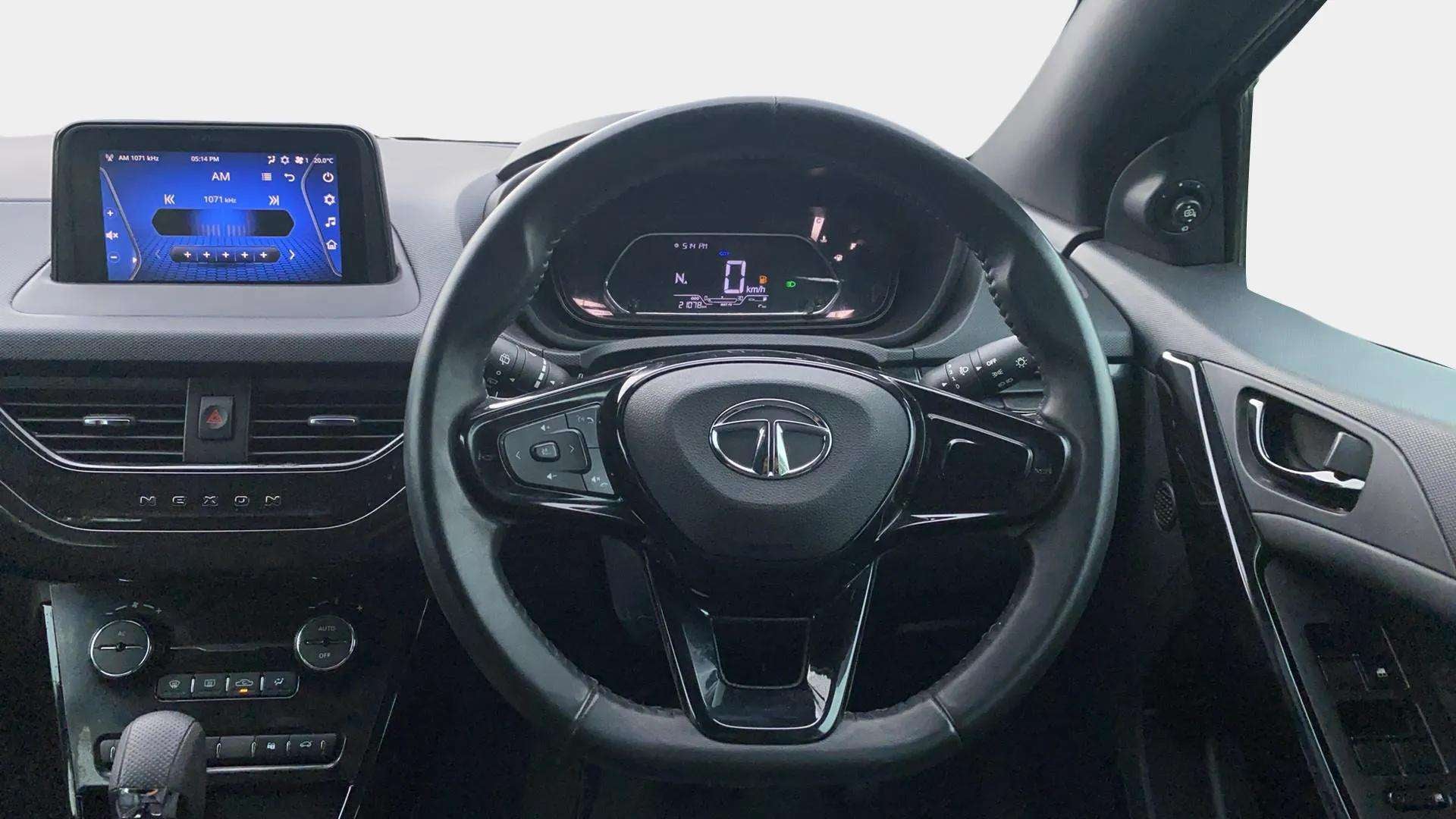 Dashboard and steering wheel view of a Tata Nexon 2017-2023