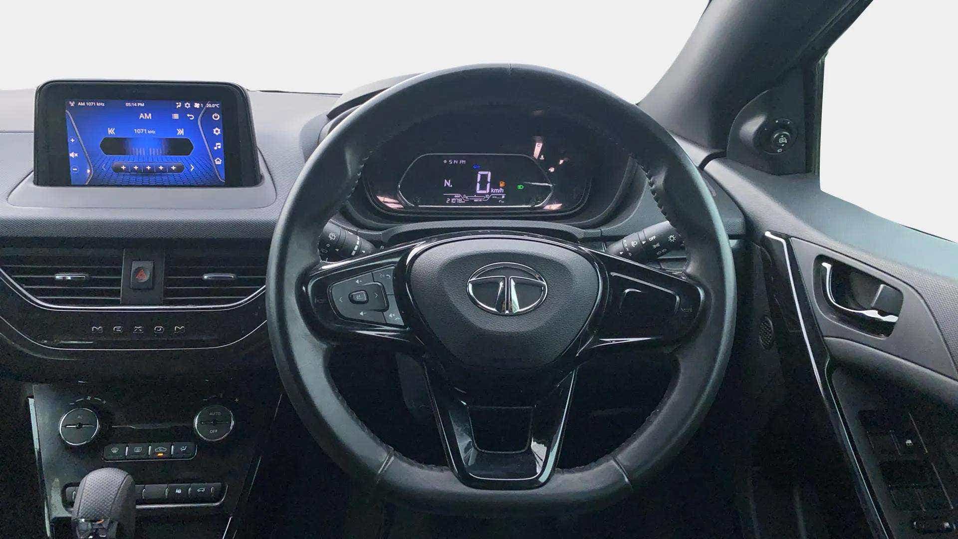 Dashboard and steering wheel view of a Tata Nexon 2017-2023