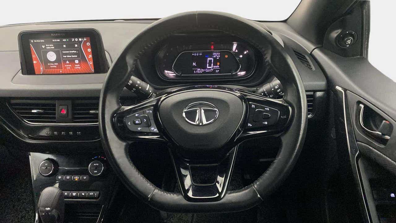 Interior dashboard and steering wheel of a Tata Nexon 2017-2023