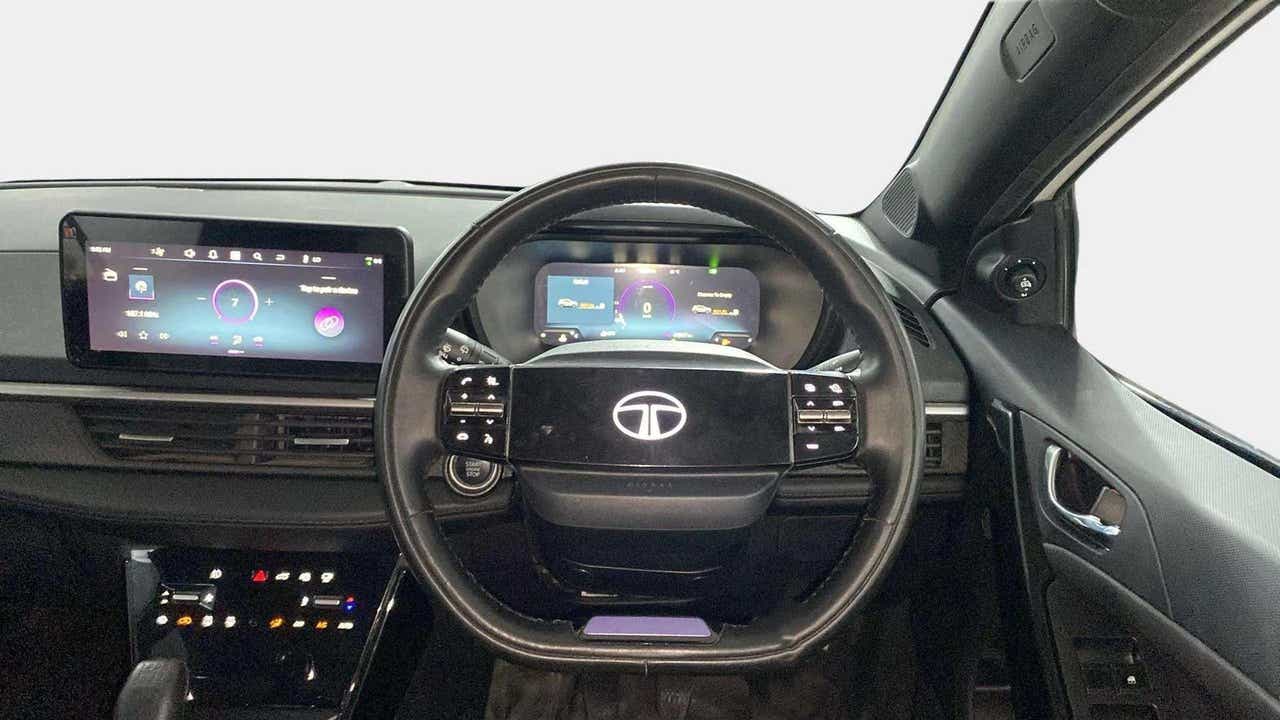 Dashboard and steering wheel view of a Tata Nexon 2017-2023