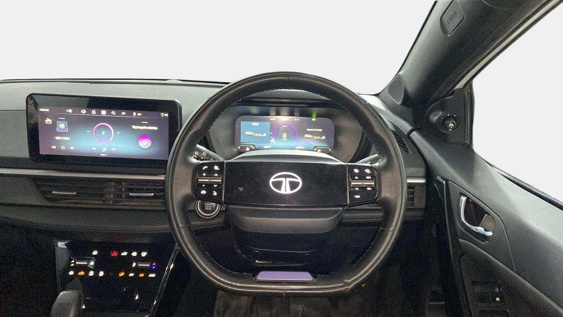 Dashboard and steering wheel view of a Tata Nexon 2017-2023