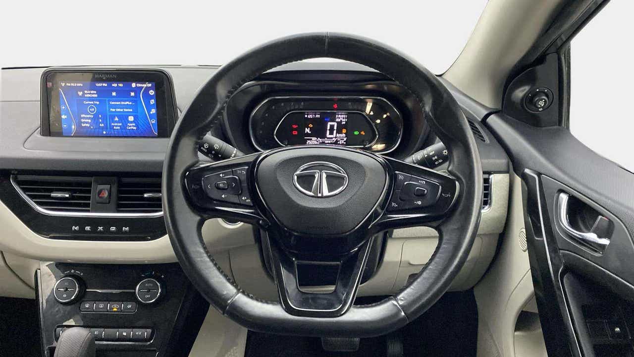 Dashboard and steering wheel view of a Tata Nexon 2017-2023