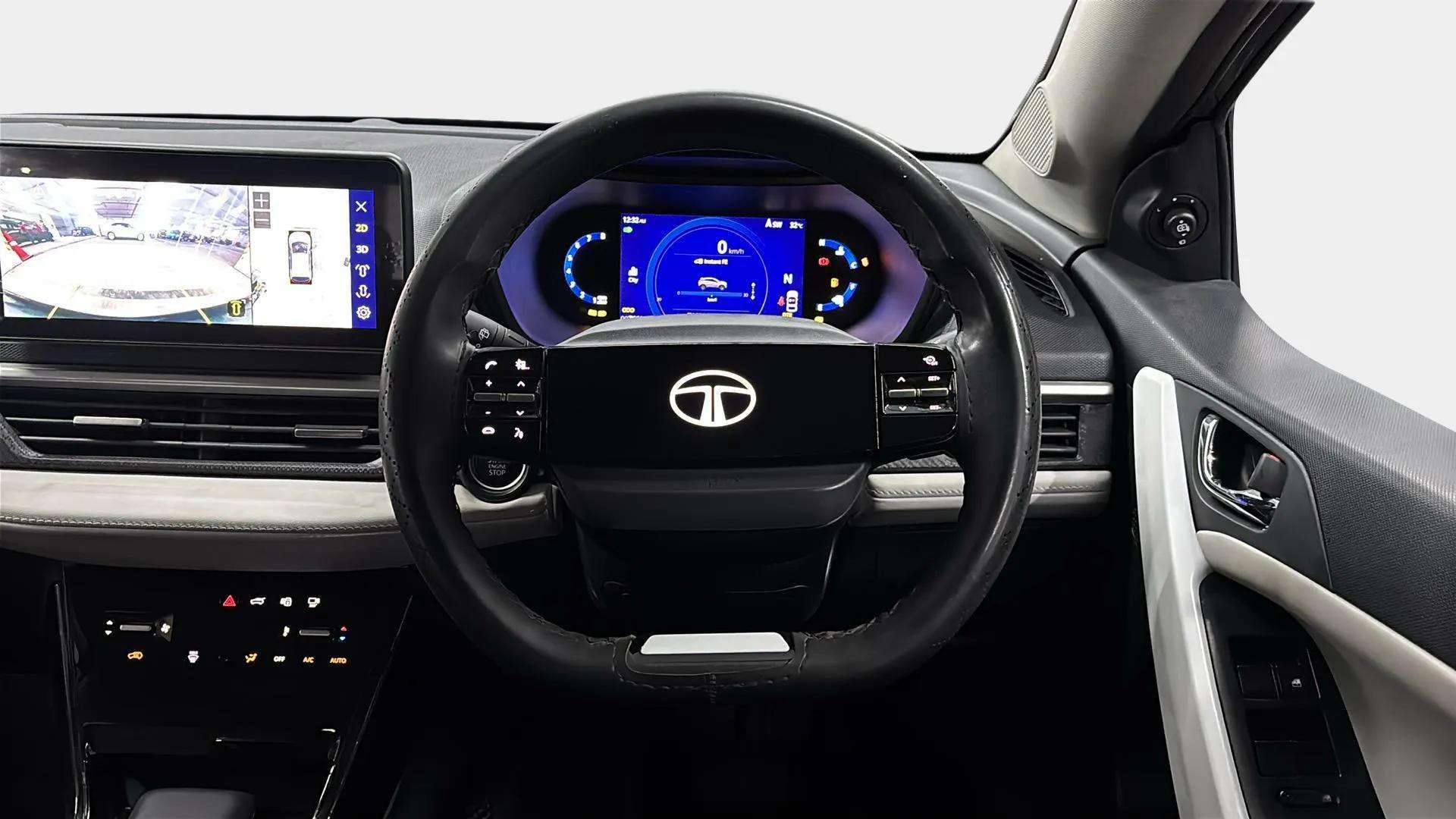Interior dashboard and steering wheel of a Tata Nexon
