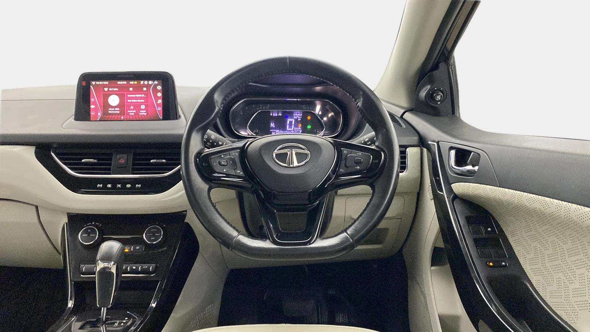 Dashboard and steering wheel view of a Tata Nexon 2017-2023