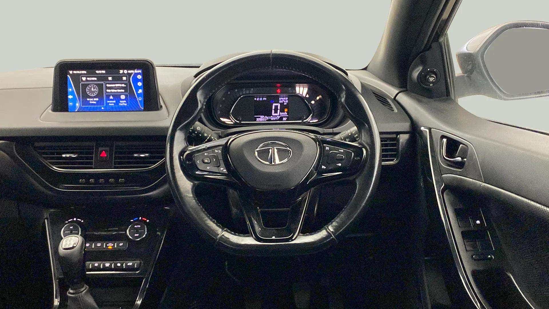 Dashboard and steering wheel view of a Tata Nexon 2017-2023