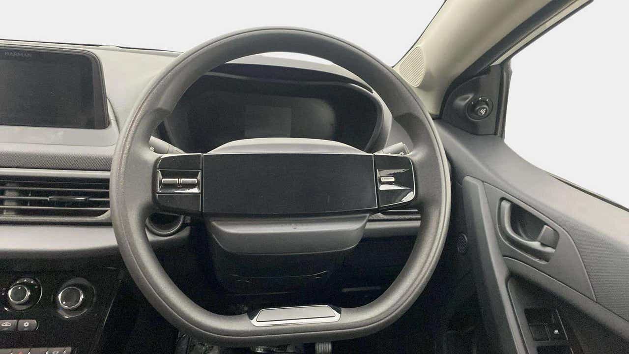 Steering wheel and dashboard interior of a Tata Nexon