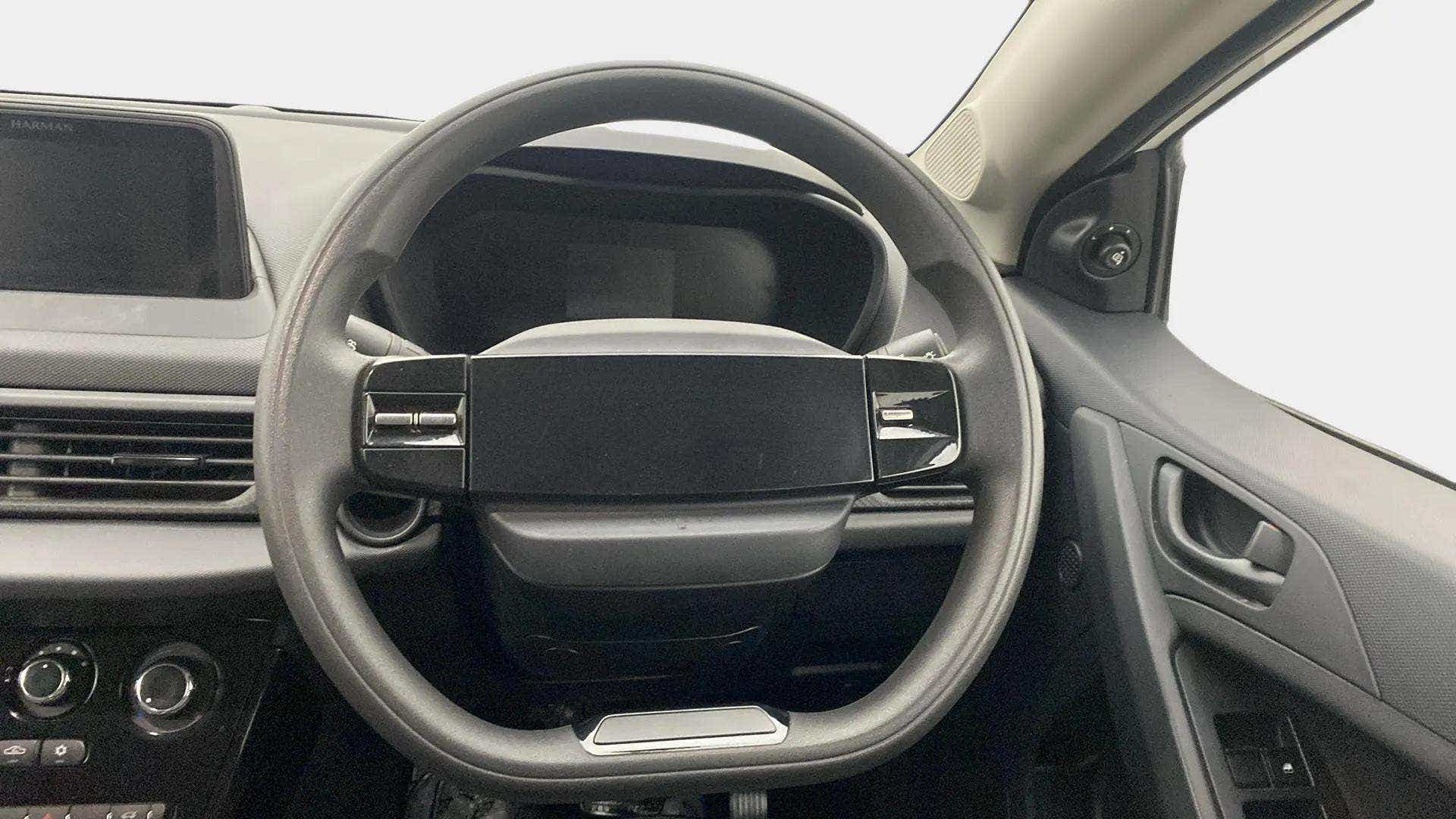 Steering wheel and dashboard interior of a Tata Nexon