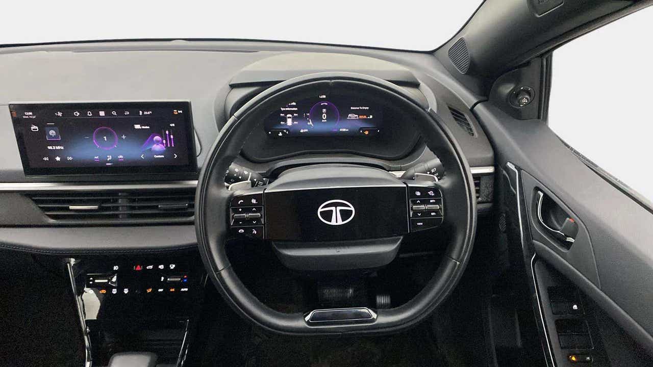 Interior dashboard and steering wheel of a Tata Nexon