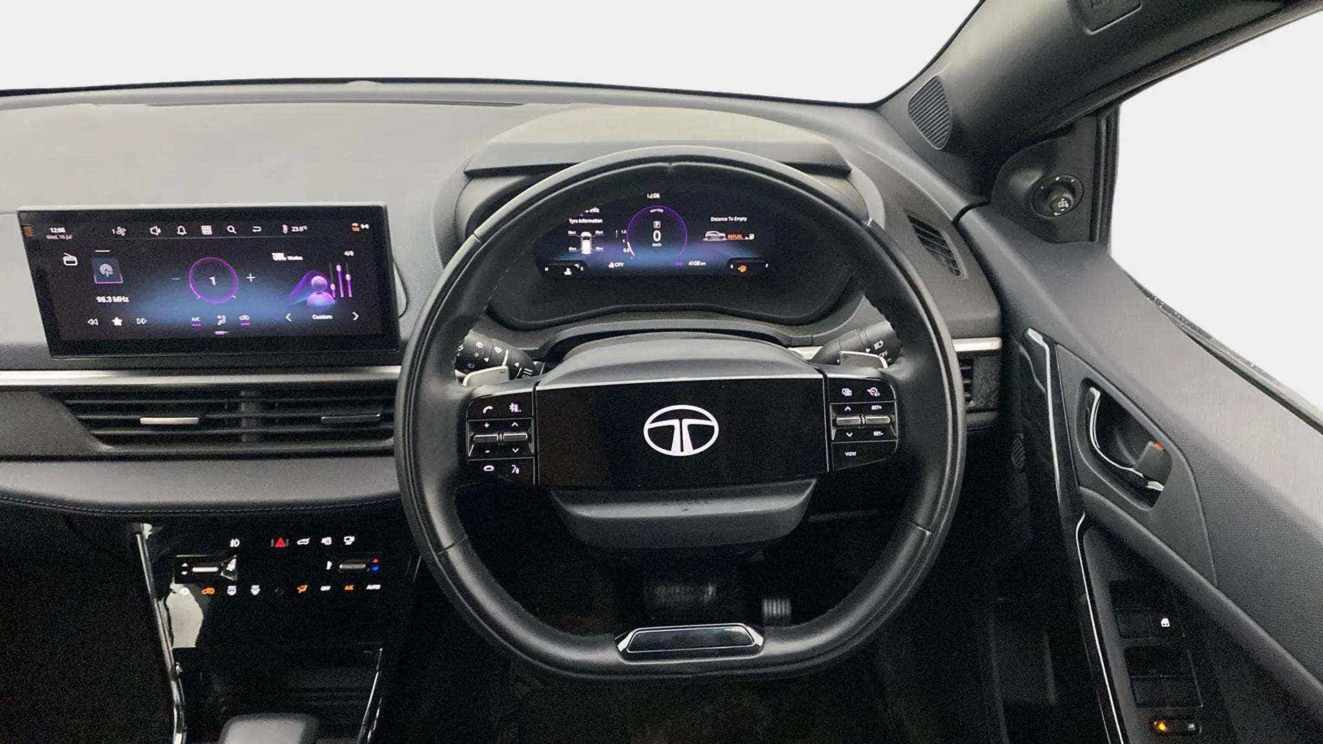 Interior dashboard and steering wheel of a Tata Nexon