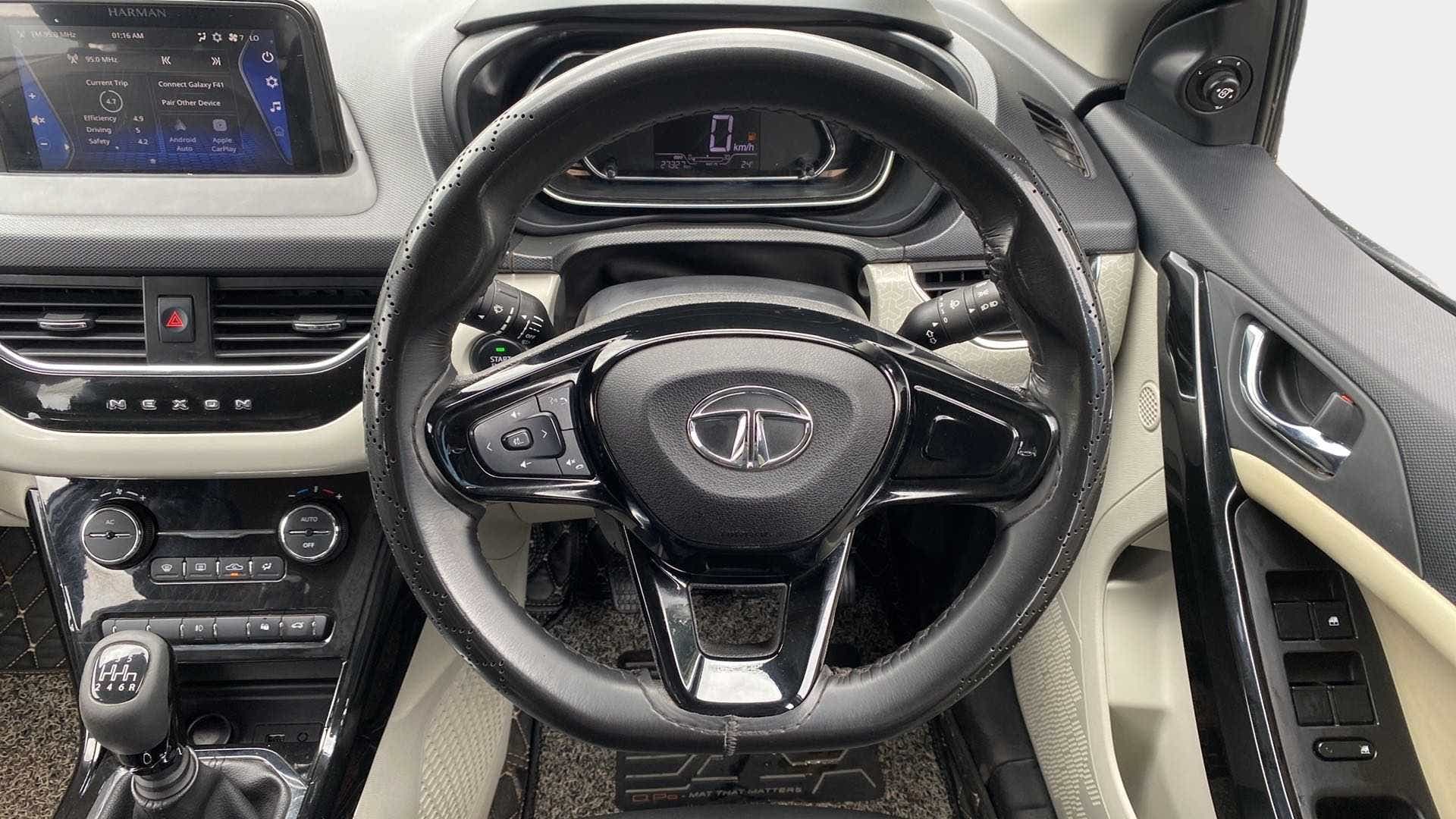 Interior dashboard and steering wheel of a Tata Nexon 2017-2023