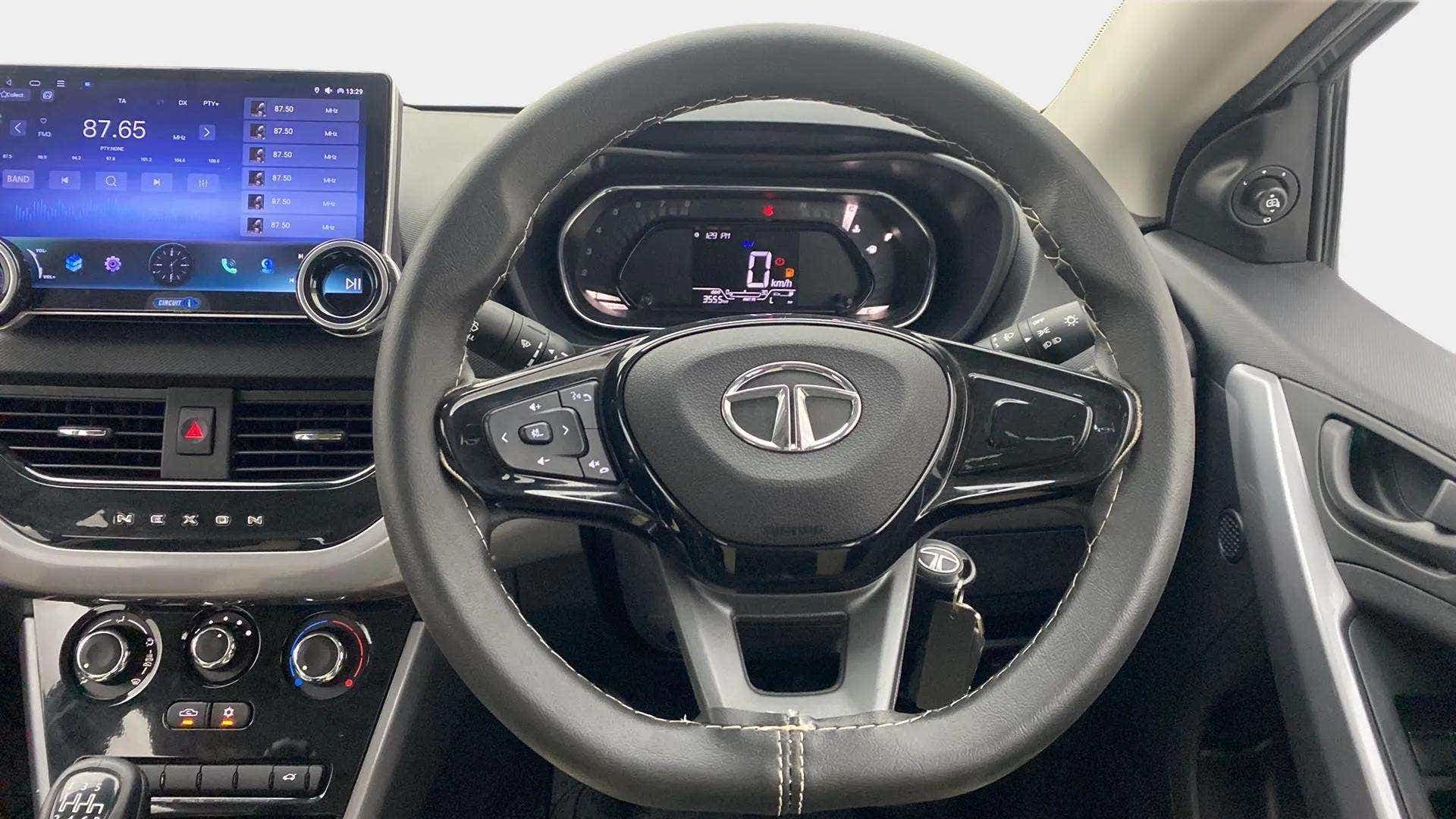 Dashboard and steering wheel view of a Tata Nexon 2017-2023