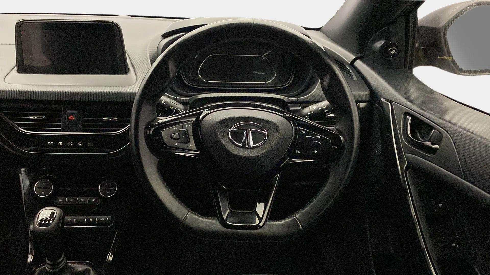 Dashboard and steering wheel view of a Tata Nexon 2017-2023
