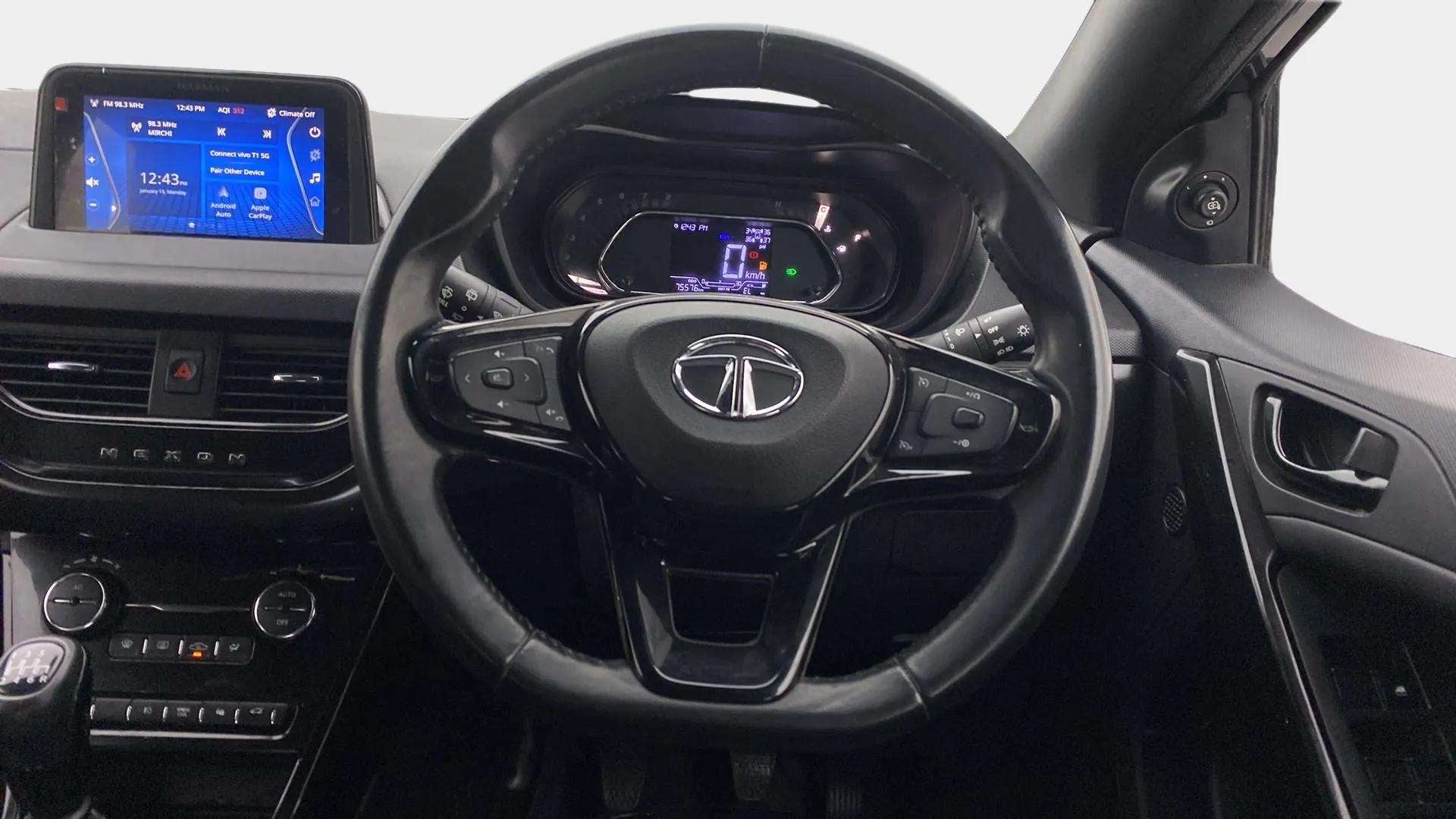 Interior dashboard and steering wheel of a Tata Nexon 2017-2023