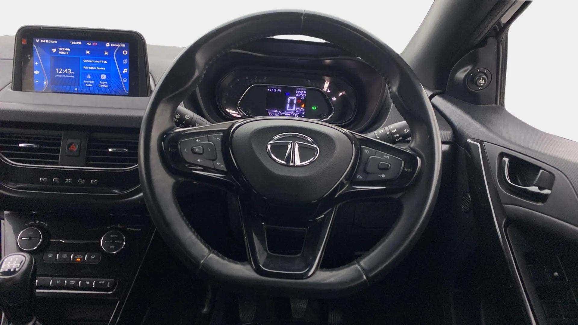 Interior dashboard and steering wheel of a Tata Nexon 2017-2023