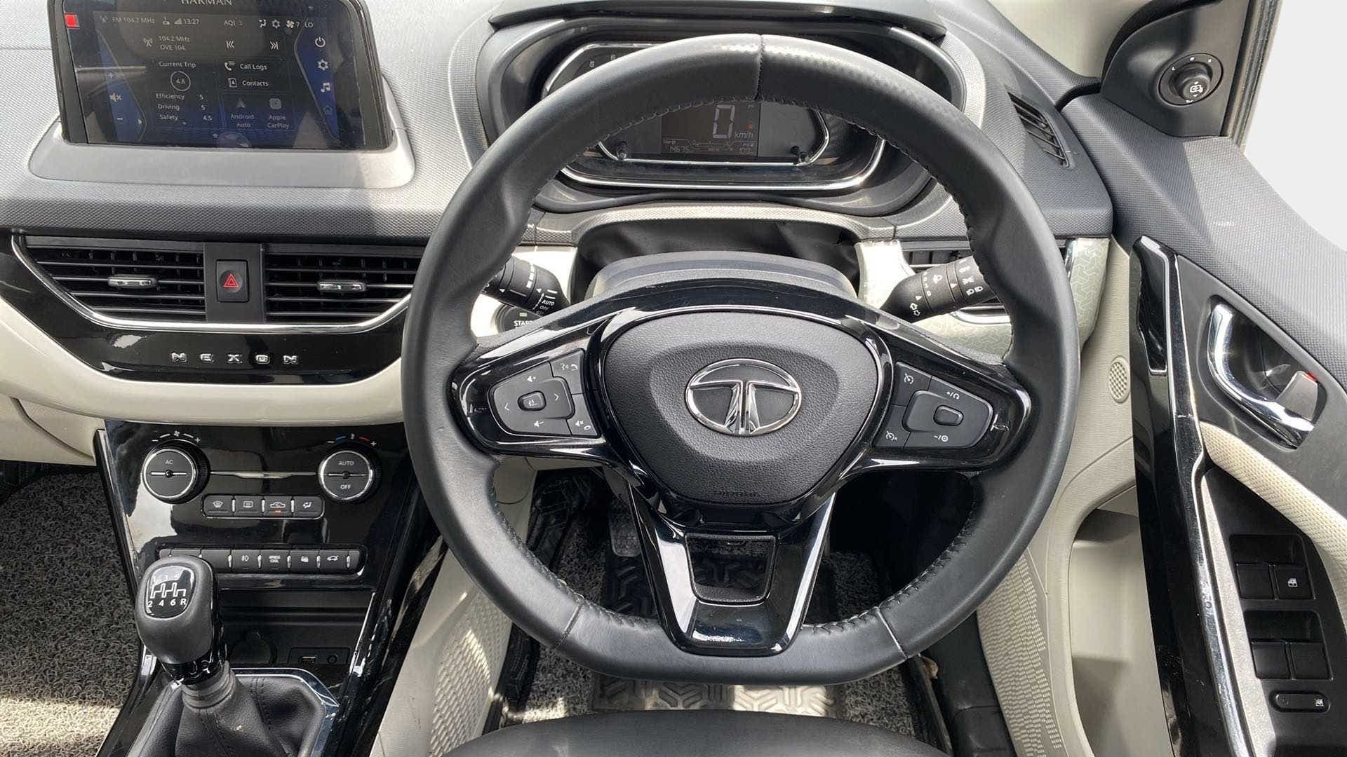 Dashboard and steering wheel view of a Tata Nexon 2017-2023