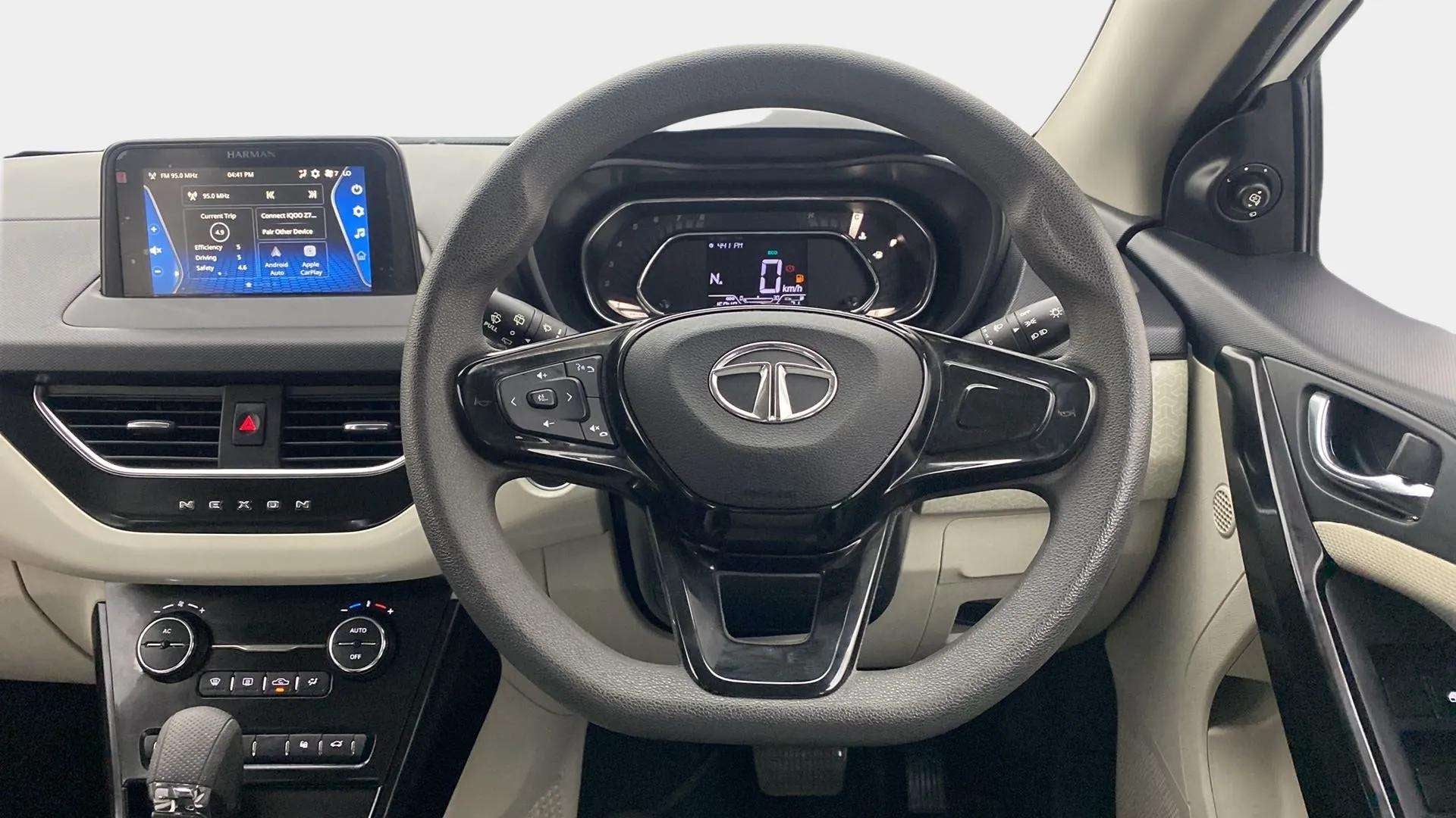 Interior dashboard and steering wheel of a Tata Nexon 2017-2023