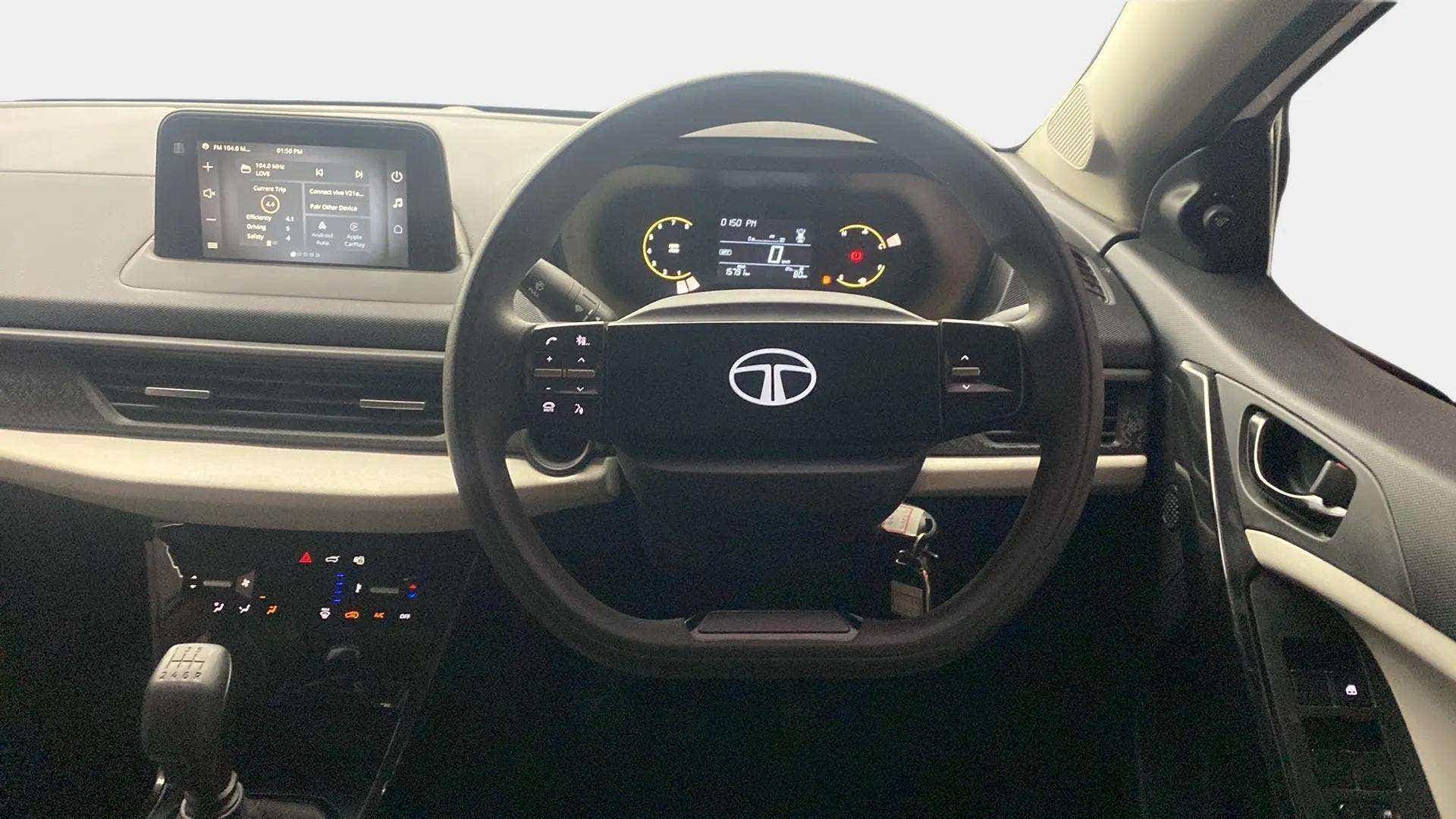 Dashboard and steering wheel view of a Tata Nexon 2017-2023