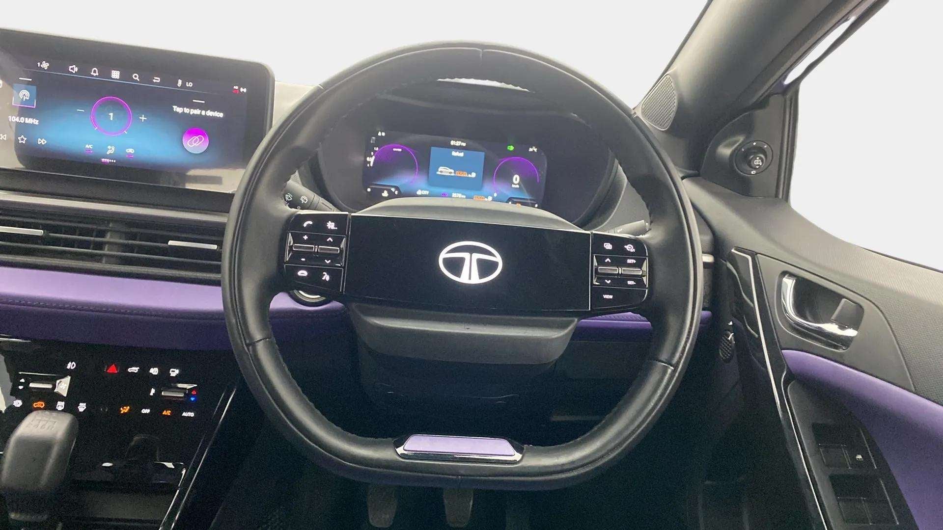 Interior dashboard and steering wheel of a Tata Nexon 2017-2023