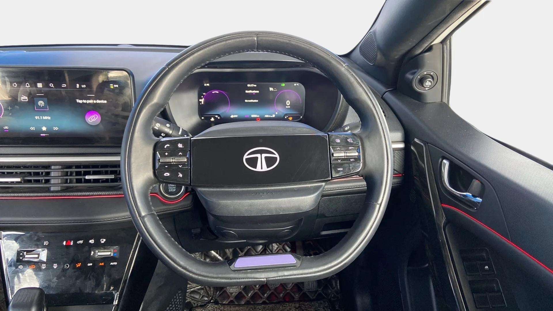 Interior dashboard and steering wheel of a Tata Nexon 2017-2023