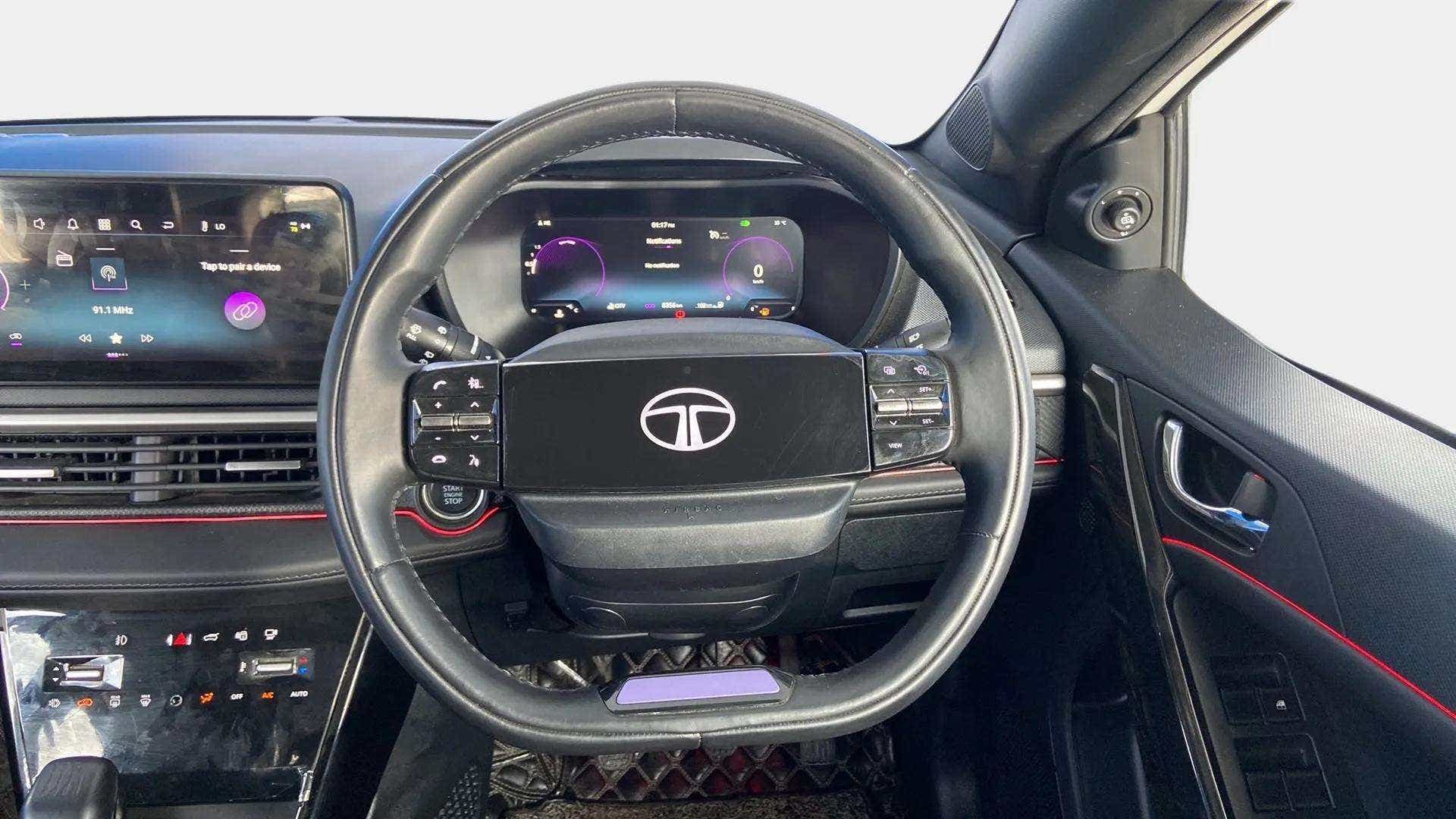Interior dashboard and steering wheel of a Tata Nexon 2017-2023