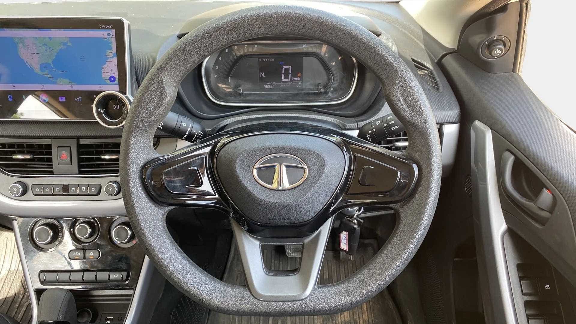 Steering wheel and dashboard view of a Tata Nexon 2017-2023