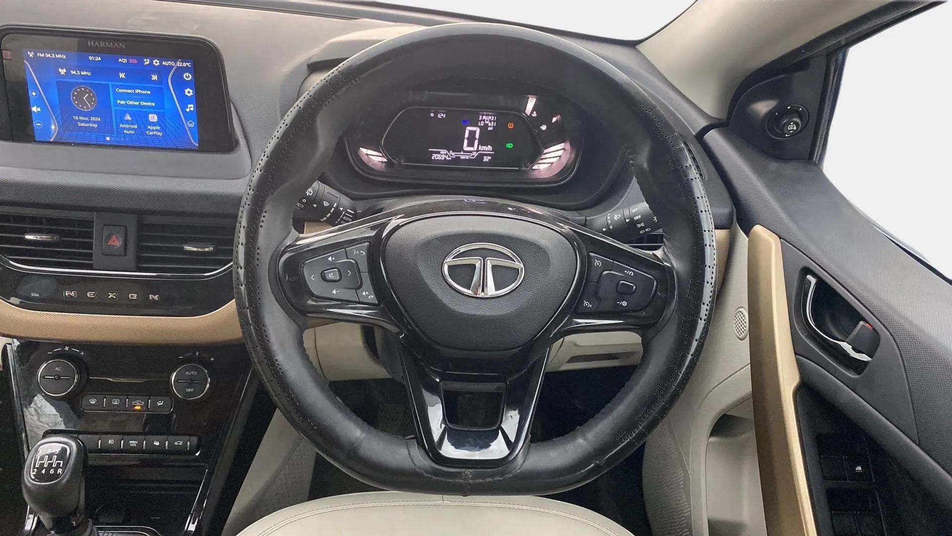 Interior dashboard and steering wheel of a Tata Nexon 2017-2023
