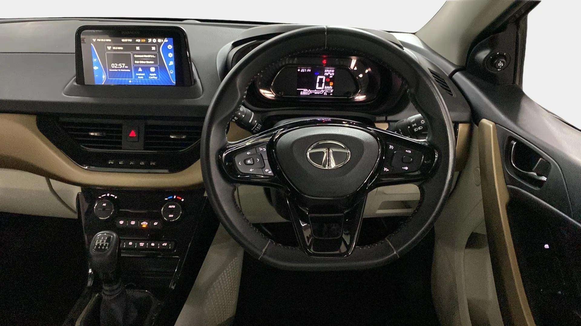 Dashboard and steering wheel view of a Tata Nexon 2017-2023