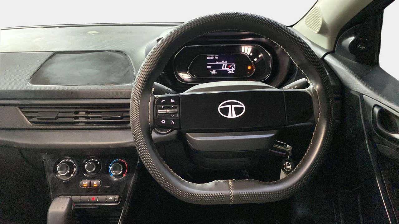 Steering wheel and dashboard view of a Tata Nexon