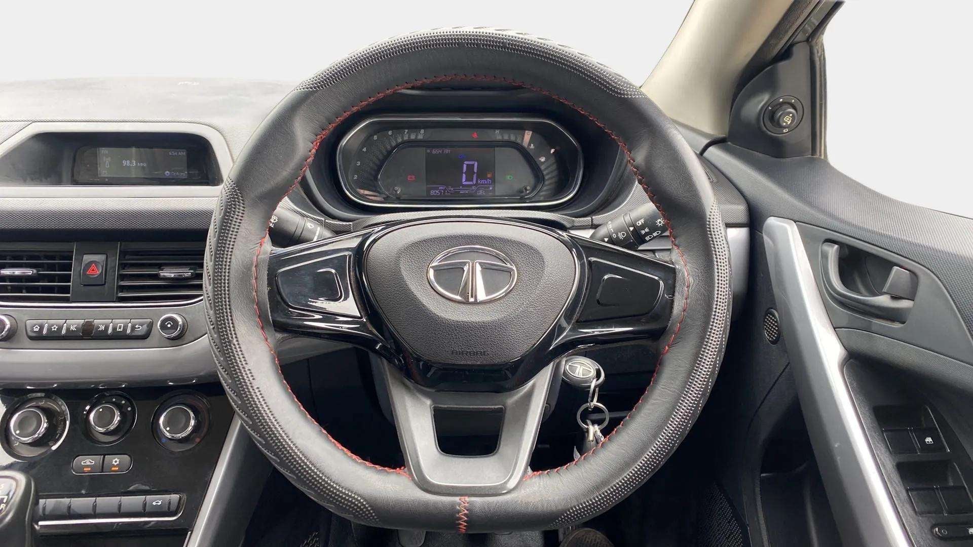 Interior dashboard and steering wheel of a Tata Nexon 2017-2023