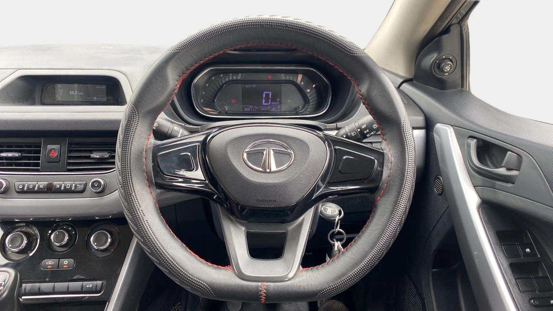 Interior dashboard and steering wheel of a Tata Nexon 2017-2023