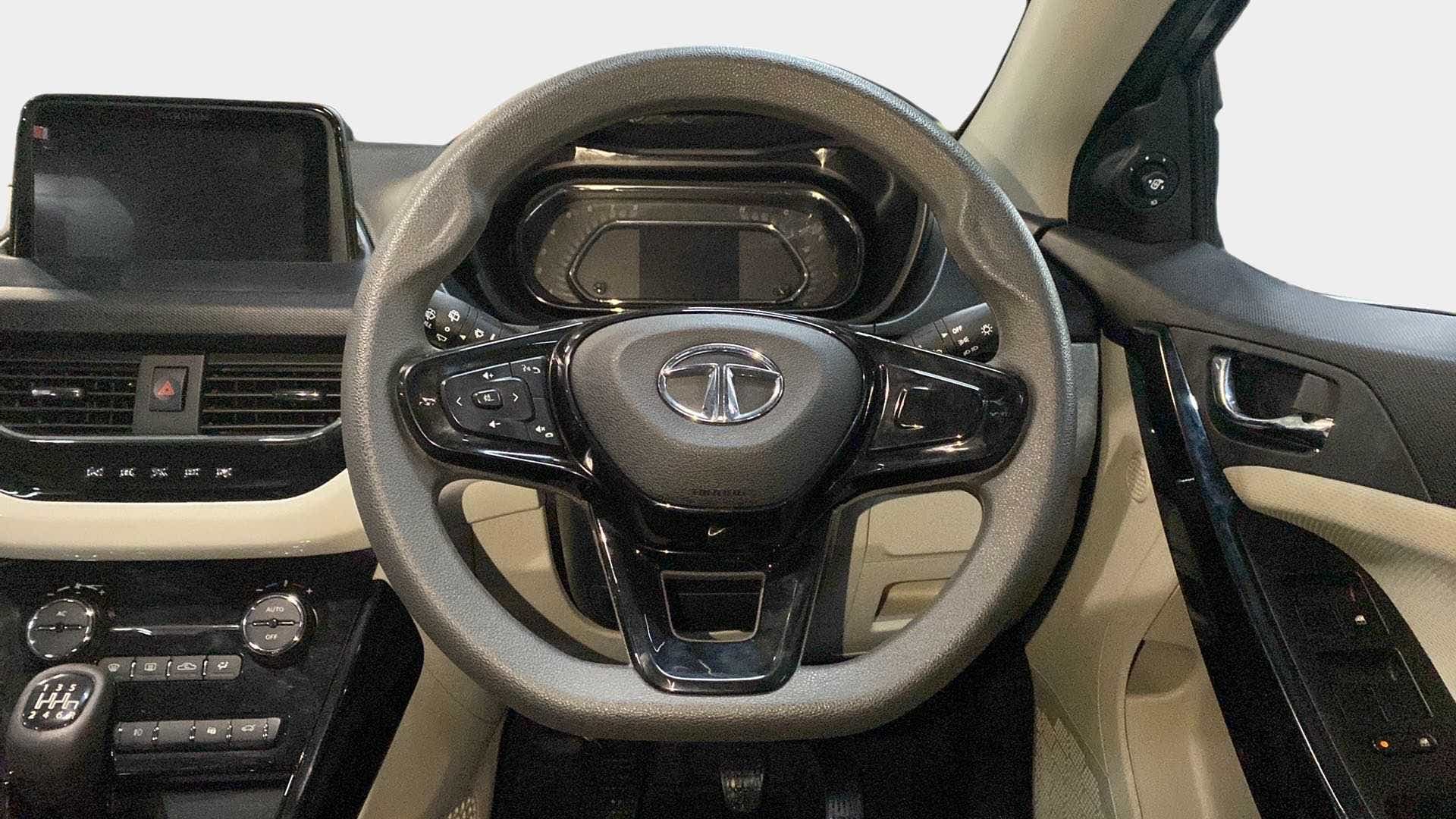 Steering wheel and dashboard view of a Tata Nexon 2017-2023