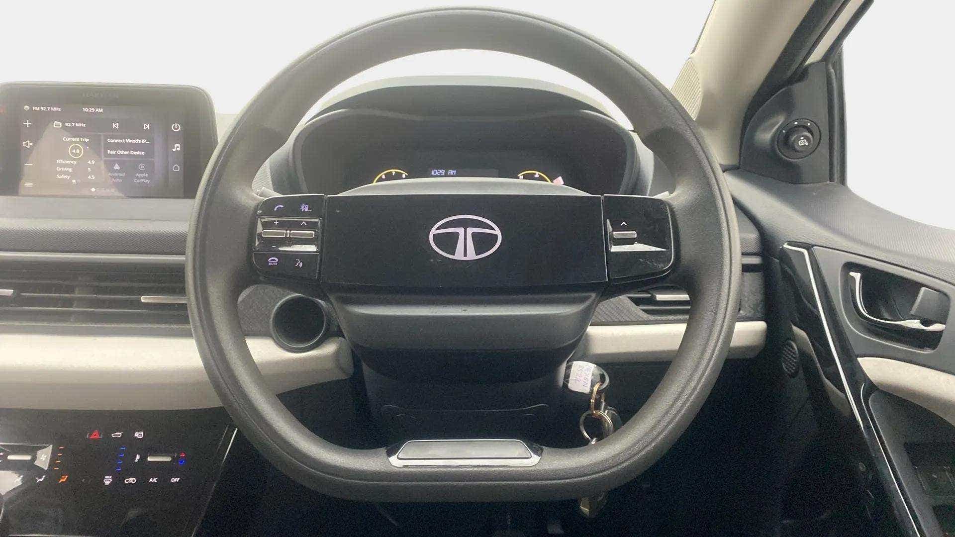 Interior dashboard and steering wheel of a Tata Nexon