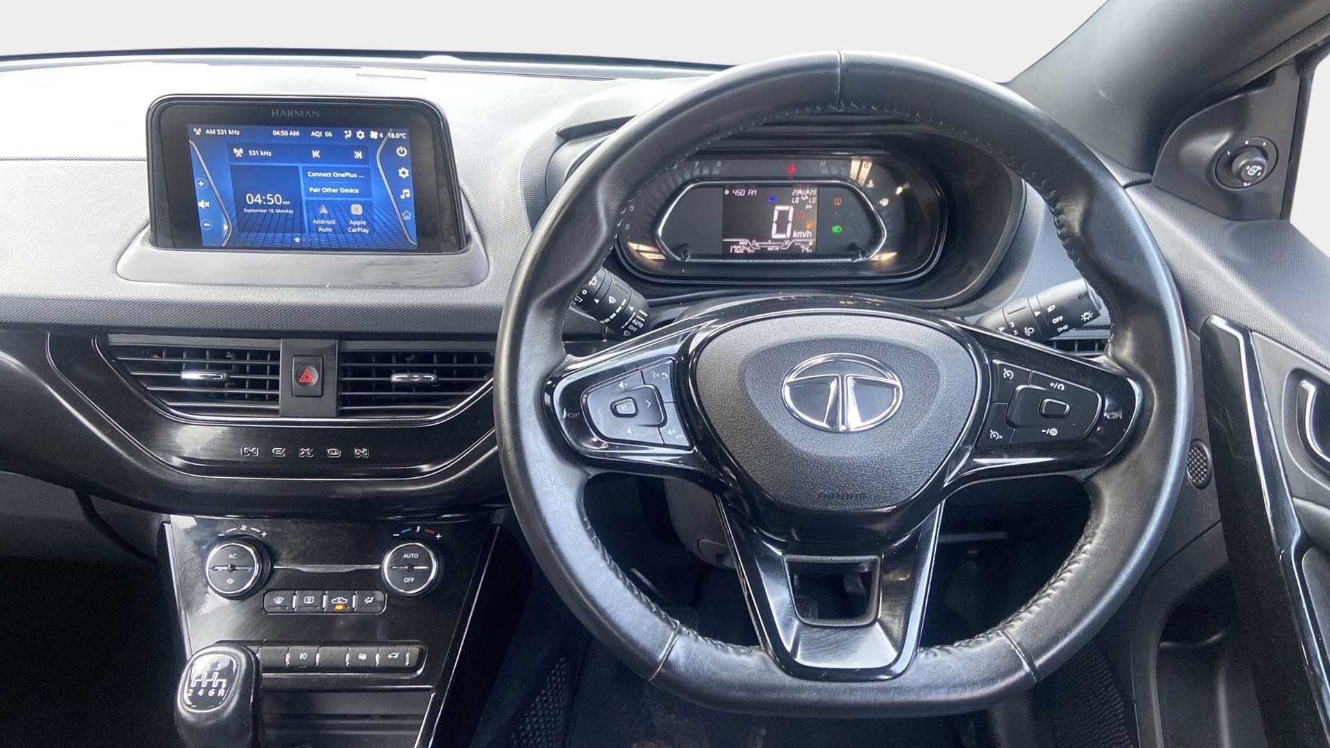 Dashboard and steering wheel view of a Tata Nexon 2017-2023