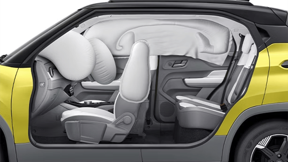 Side cutaway view of a fearless yellow with dt Tata Punch EV Facelift showing deployed airbags