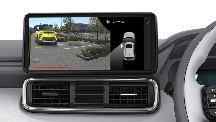 Infotainment screen showing left side view camera of a fearless yellow Tata Punch EV Facelift