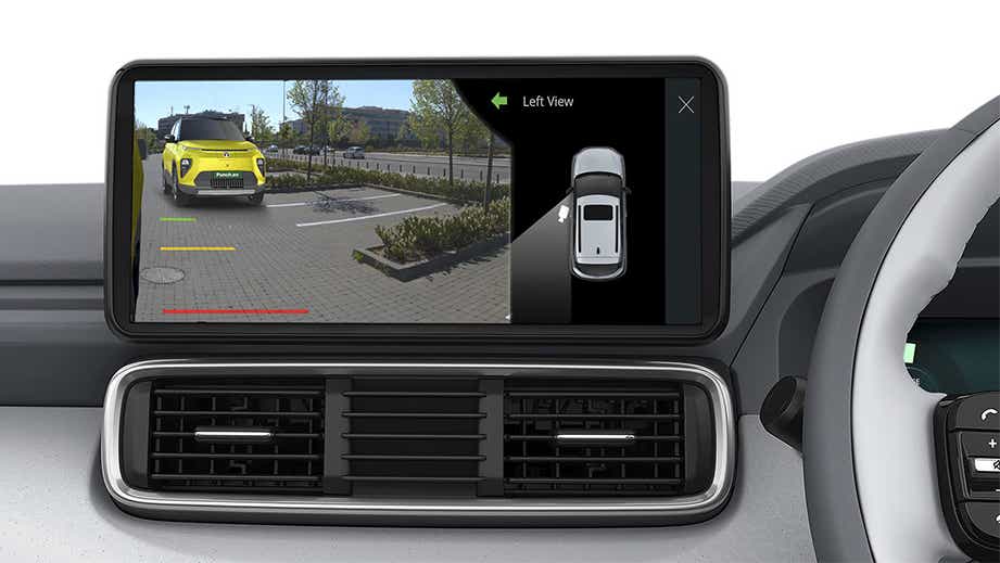 Infotainment screen showing left side view camera of a fearless yellow Tata Punch EV Facelift