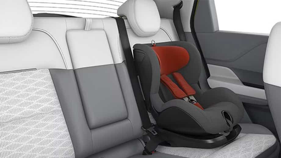 Rear seat with child safety seat of a Prestine White with DT Tata Punch EV Facelift