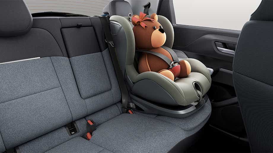 Rear seat and child seat of a black Tata Punch Facelift
