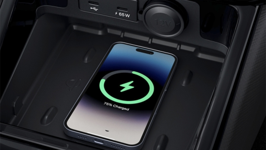 Wireless charging pad with phone in a black Tata Punch Facelift