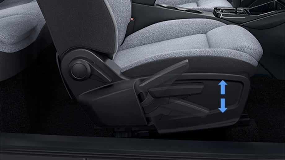 Front seat height adjustment lever of a black Tata Punch Facelift