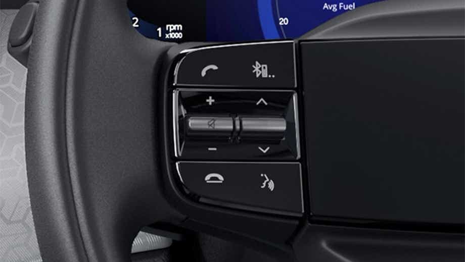 Steering wheel control close-up of a black Tata Punch Facelift