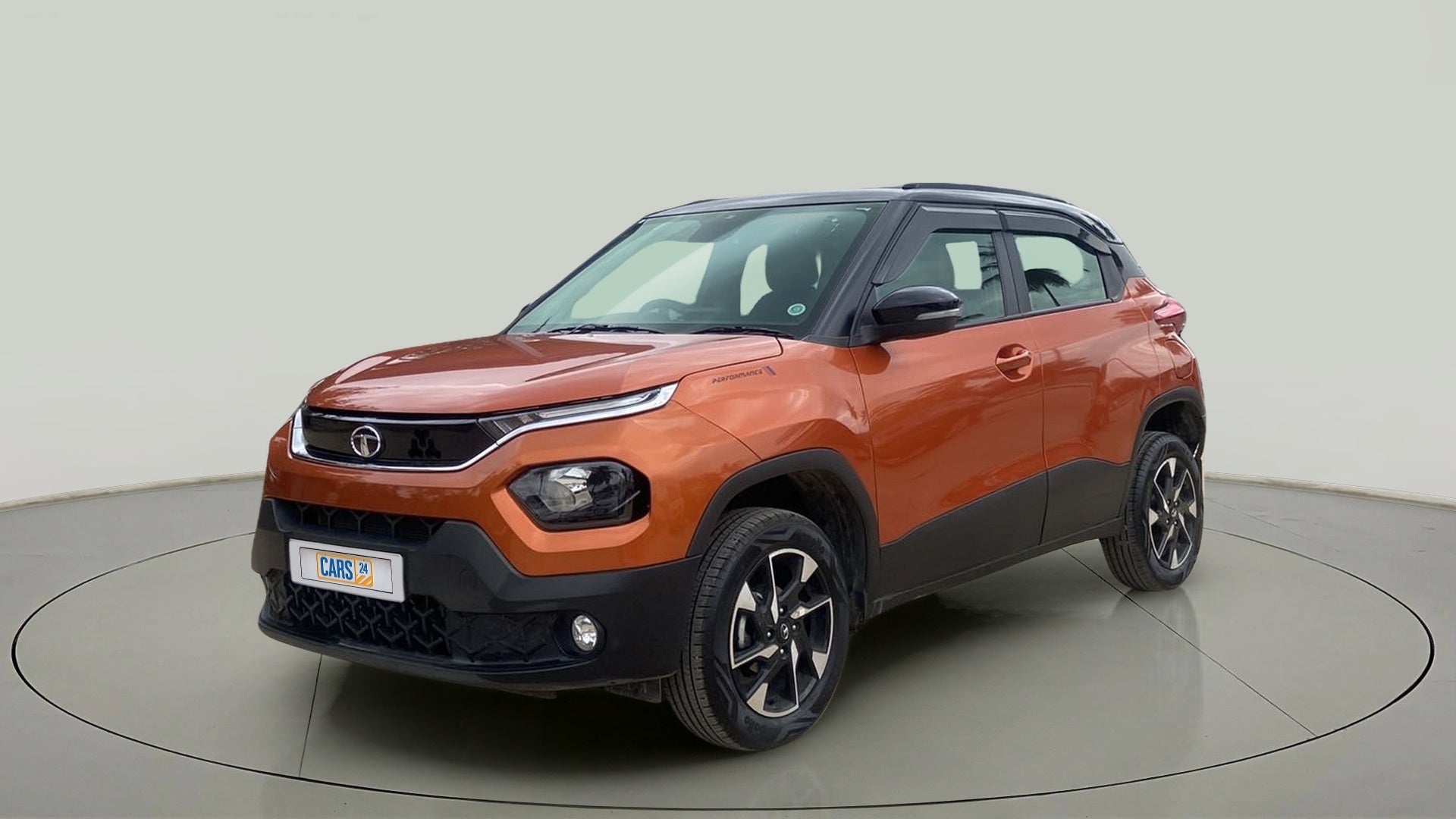 Front three-quarter view of a Atomic Orange Tata Punch