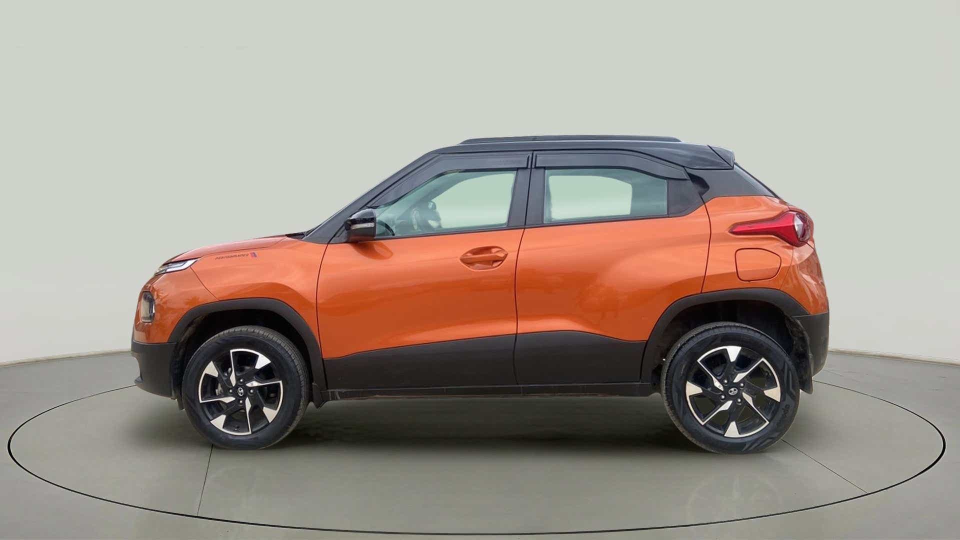 Side view of an Atomic Orange Tata Punch