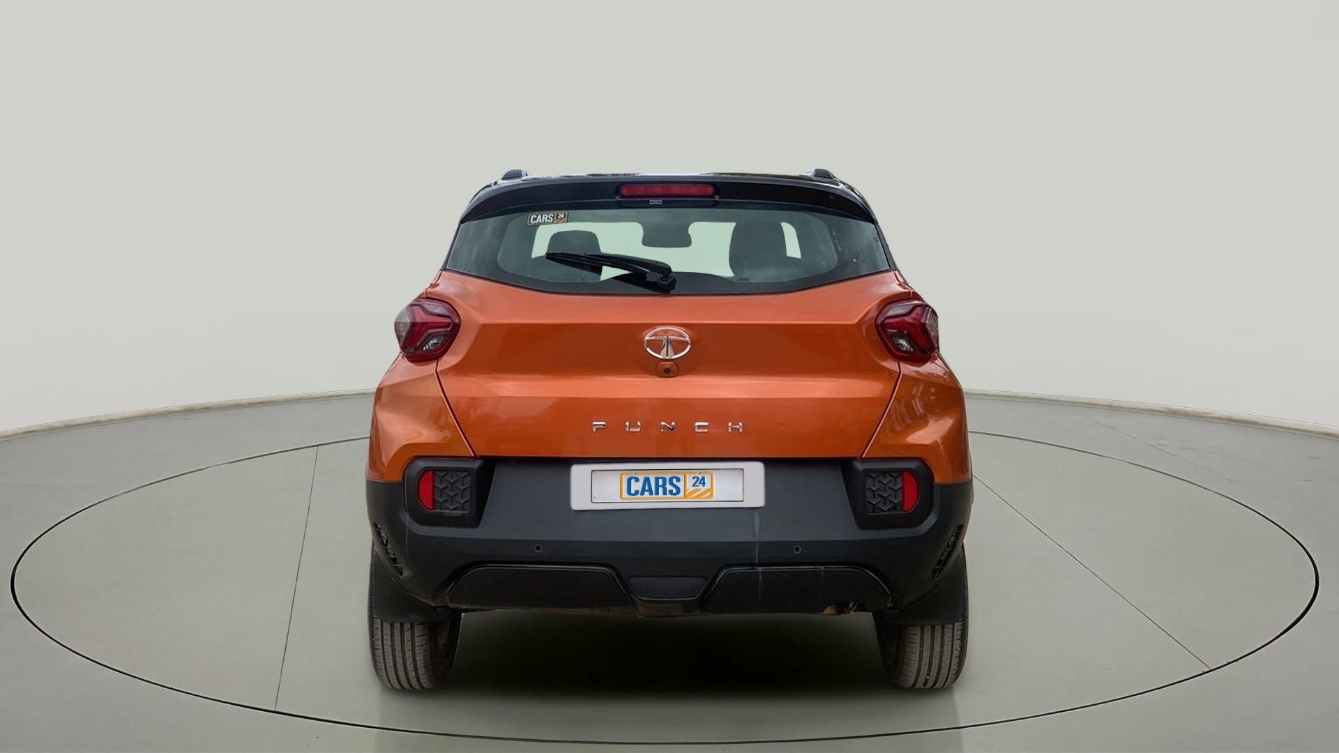 Rear view of a Atomic Orange Tata Punch
