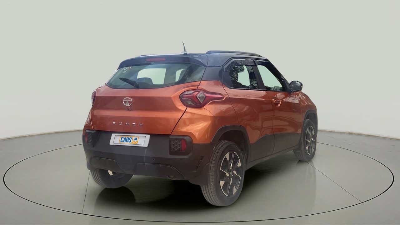 Rear three-quarter view of a atomic-orange Tata Punch