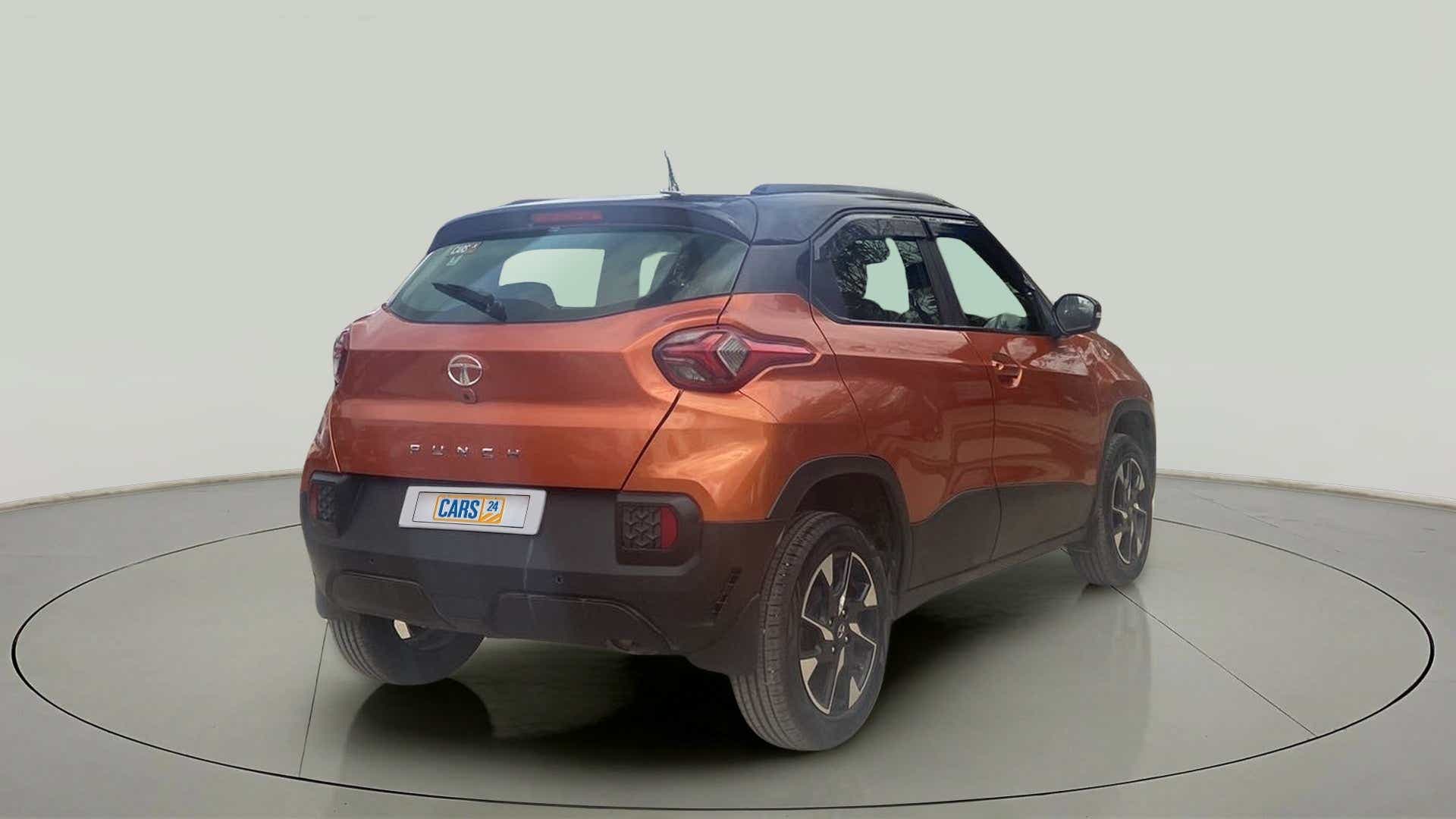 Rear three-quarter view of a atomic-orange Tata Punch