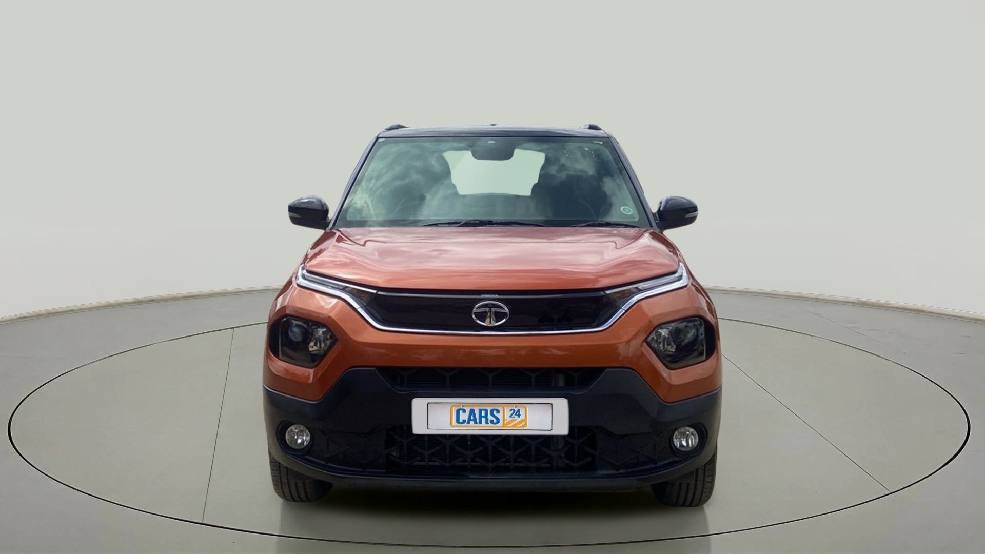 Front view of a Atomic Orange Tata Punch