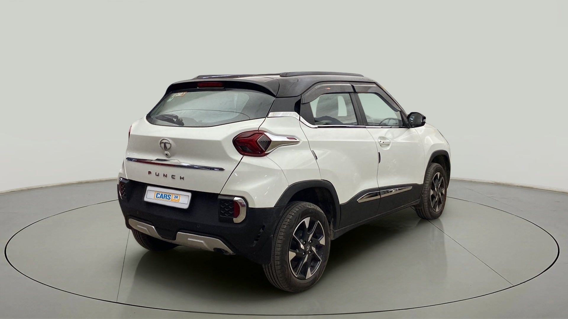 Rear three-quarter view of a Calypso Red with White Roof Tata Punch