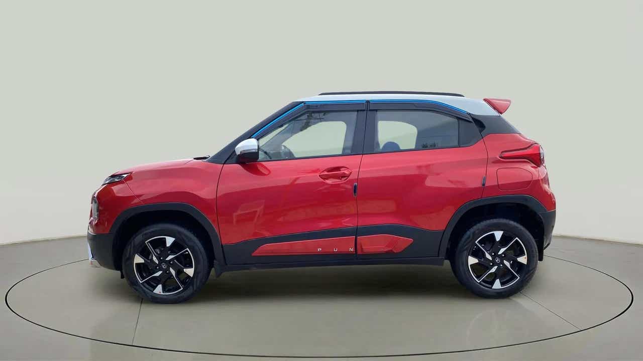 Side view of a Calypso Red with White Roof Tata Punch